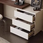 Modern vanity table with mirror and drawers in a bedroom setting