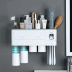 Close-up of the magnetic adsorption feature, showing toothbrush attached upside down to the holder.