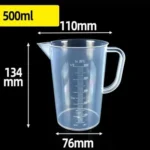 Transparent plastic lab beaker with measurement scale on kitchen counter