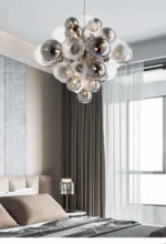 Smoky gray chandelier with glass bubbles hanging over a modern dining table