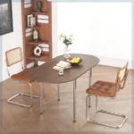 Nordic minimalist folding dining table with stainless steel telescopic extension in a modern living room setting