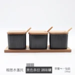 Ceramic kitchen storage container set with matte striped design and spoon