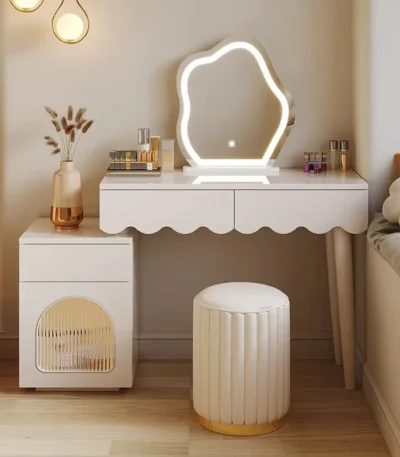 Modern makeup vanity desk with mirror and stool in a bedroom setting, showcasing ample storage and elegant design