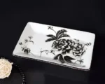 Soap dish with a soap bar partially used, showing the ceramic's white interior.