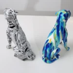 Detailed view of the paint splash pattern on the boxer dog's body.