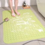 Non slip bath mat with suction cups in a white bathroom