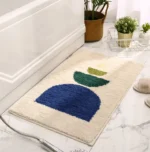 Modern abstract art non slip bathroom rug with vibrant colors and textured surface on a bathroom floor