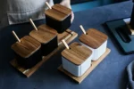 Ceramic kitchen storage container set with matte striped design and spoon