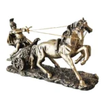 Sculpture placed on a stack of vintage books, rustic office accessory.