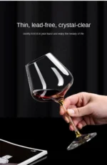Elegant crystal wine glass set on a wooden table with soft lighting