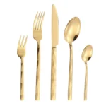 Luxury stainless steel flatware set with diamond 3D texture on a wooden table