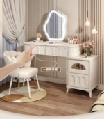 Modern wood makeup vanity table with mirror, drawer, and stool in a bedroom setting