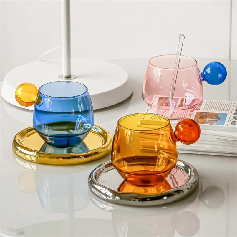 Nordic coffee cup set with saucer and spoon on a wooden table