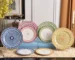 Elegant dinnerware set with swan motif ceramic plates on table