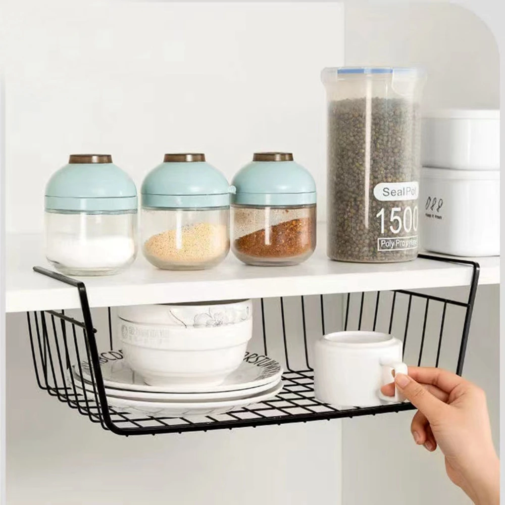 Sec74d6c8f6af4281b39b5736459a909eR.webp Metal under shelf basket hanging from a kitchen shelf, holding spices and small jars