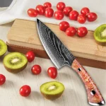 Damascus steel cleaver with wooden sheath on cutting board