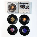 Set of vinyl record coasters on a wooden table