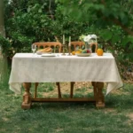 Retro polka dot tablecloth with fringe on a wooden table