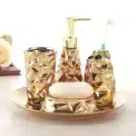 Goldoma ceramic lotion bottle with golden cap, macro shot showing texture and shine.