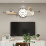 Battery-operated wall clock mounted on a textured grey wall in a minimalist home office.