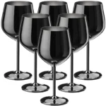 Set of 6 stainless steel wine glasses on a wooden table with red wine