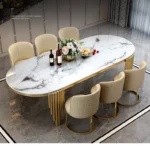 Modern oval marble dining table with gold stainless steel legs seating 6-8 people - Goldoma