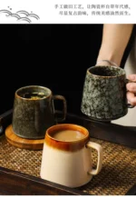 Vintage ceramic coffee mug with underglaze floral pattern on wooden table
