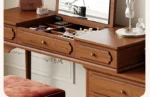 Minimalist oak wood dressing table with mirror, stool, and six drawers in a modern bedroom setting