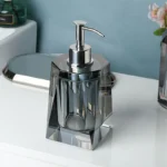 Lotion pump bottle with metallic finish pump head.