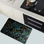 Blue and gold 3D stone diatomaceous earth fast drying bath mat on bathroom floor