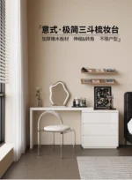 Modern vanity table with mirror and drawers in a bedroom setting
