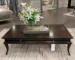 Modern coffee table with metal frame in living room setting