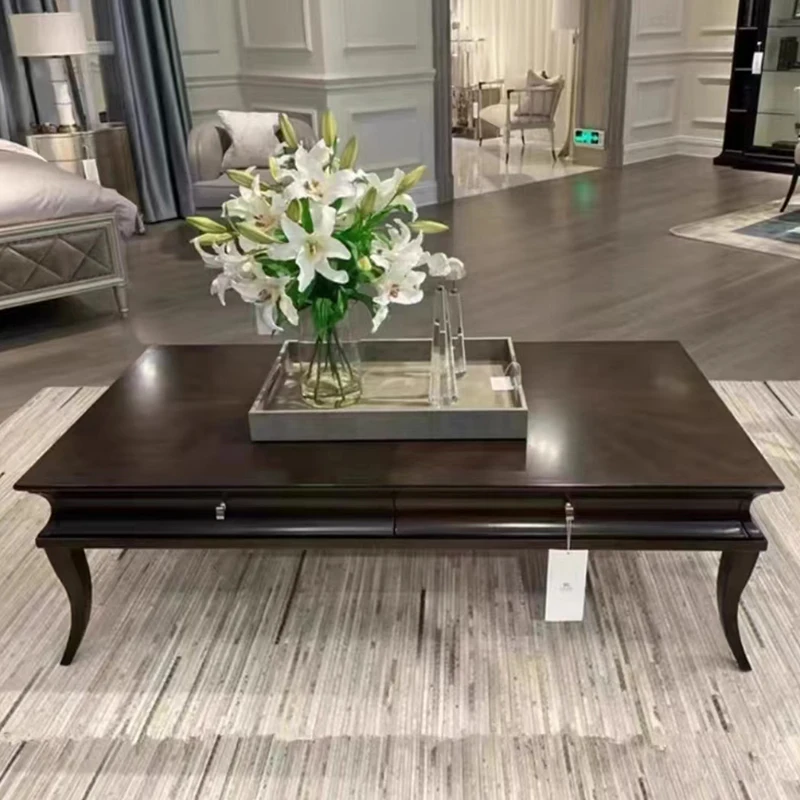 Sf5c34c80e8be41878deca13ffd560524j.webp Minimalist coffee table with metal frame in a modern living room setting, Goldoma