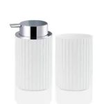 White foam soap dispenser with a silver pump, placed on a wooden tray in a bathroom.