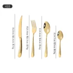 Elegant gold flatware set with steak knife, fork, and spoon on a dark table