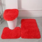 Plush bathroom rug set with toilet lid cover and mat in a modern bathroom