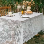 Retro polka dot tablecloth with fringe on a wooden table