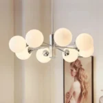 Nordic designer multi-head glass LED chandelier in a modern living room, warm light illuminating the space.