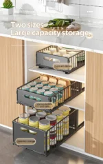 Pull out cabinet organizer holding spice bottles and seasoning jars in a kitchen cabinet