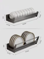 Stainless steel wall mounted dish rack holding plates and bowls in a modern kitchen