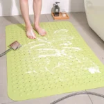 Non slip bath mat with suction cups in a white bathroom