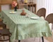 French country tablecloth with retro plaid pattern and lotus leaf edge on a dining table