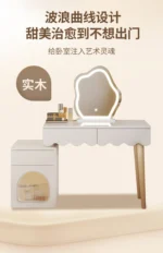 Modern makeup vanity desk with mirror and stool in a bedroom setting, showcasing ample storage and elegant design