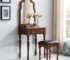 Classic solid wood vanity with mirror and drawer in a cozy bedroom setting