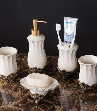 European-style white porcelain lotion bottle with vintage palace design on a marble countertop.