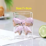 Elegant pink bow glass cup with heat-resistant borosilicate glass, perfect for champagne and cold drinks