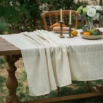 Retro polka dot tablecloth with fringe on a wooden table
