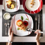 MALACASA Felisa red stripe dinnerware set arranged on a dining table