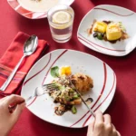 MALACASA Felisa red stripe dinnerware set arranged on a dining table