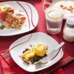 MALACASA Felisa red stripe dinnerware set arranged on a dining table